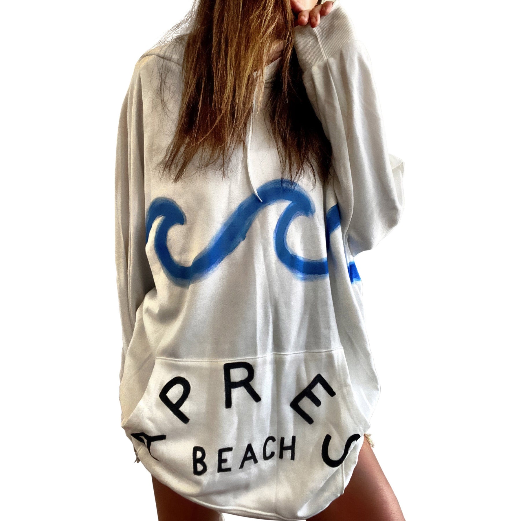 Oversized white sweatshirt dress. Blue wave painted along entire sweatshirt, on chest area, with APRES BEACH painted in black on front pocket. Signed @wrenandglory.