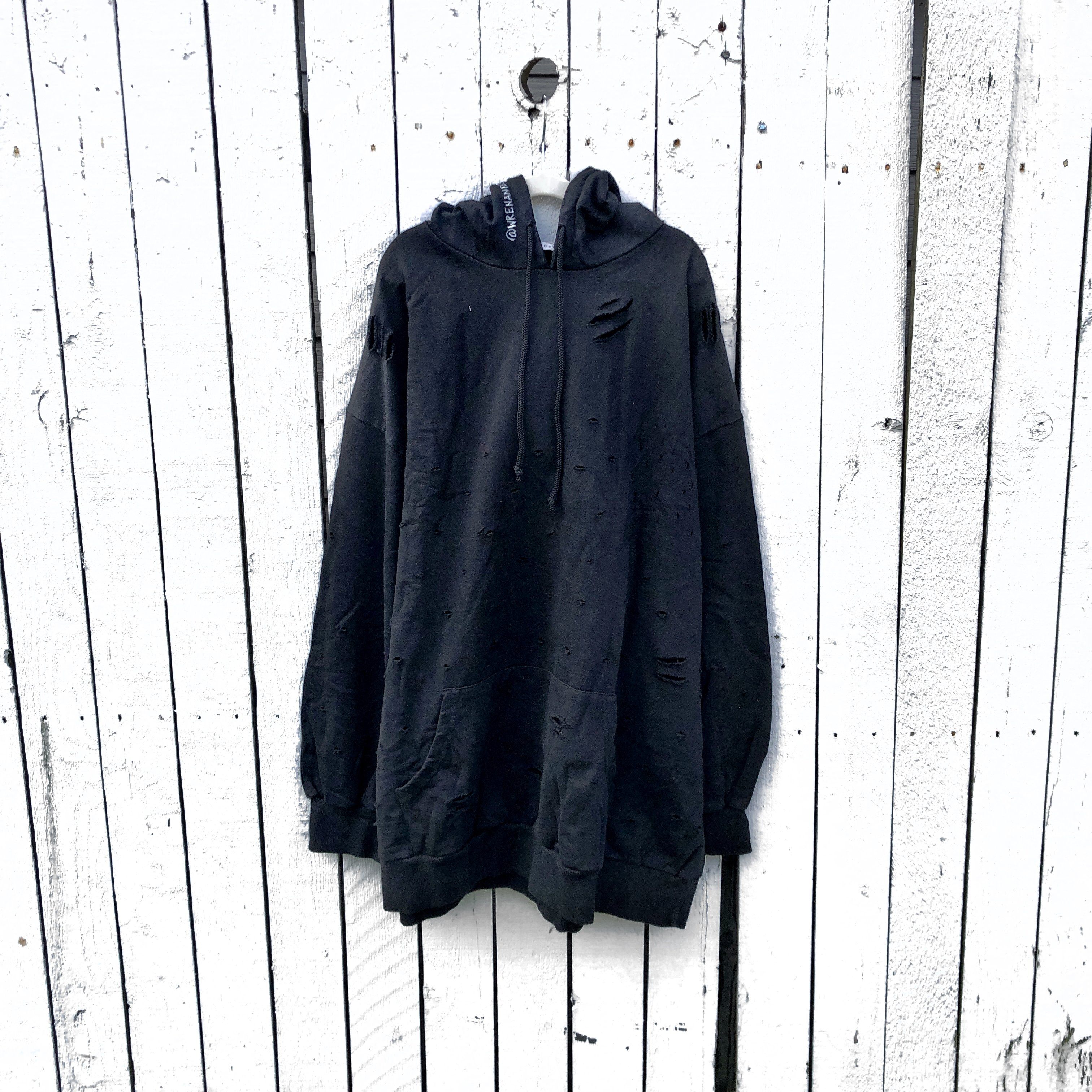 The perfect oversized black distressed hoodie. APRES SKI painted on back in semi circle, with mountain outline along bottom. Signed @wrenandglory