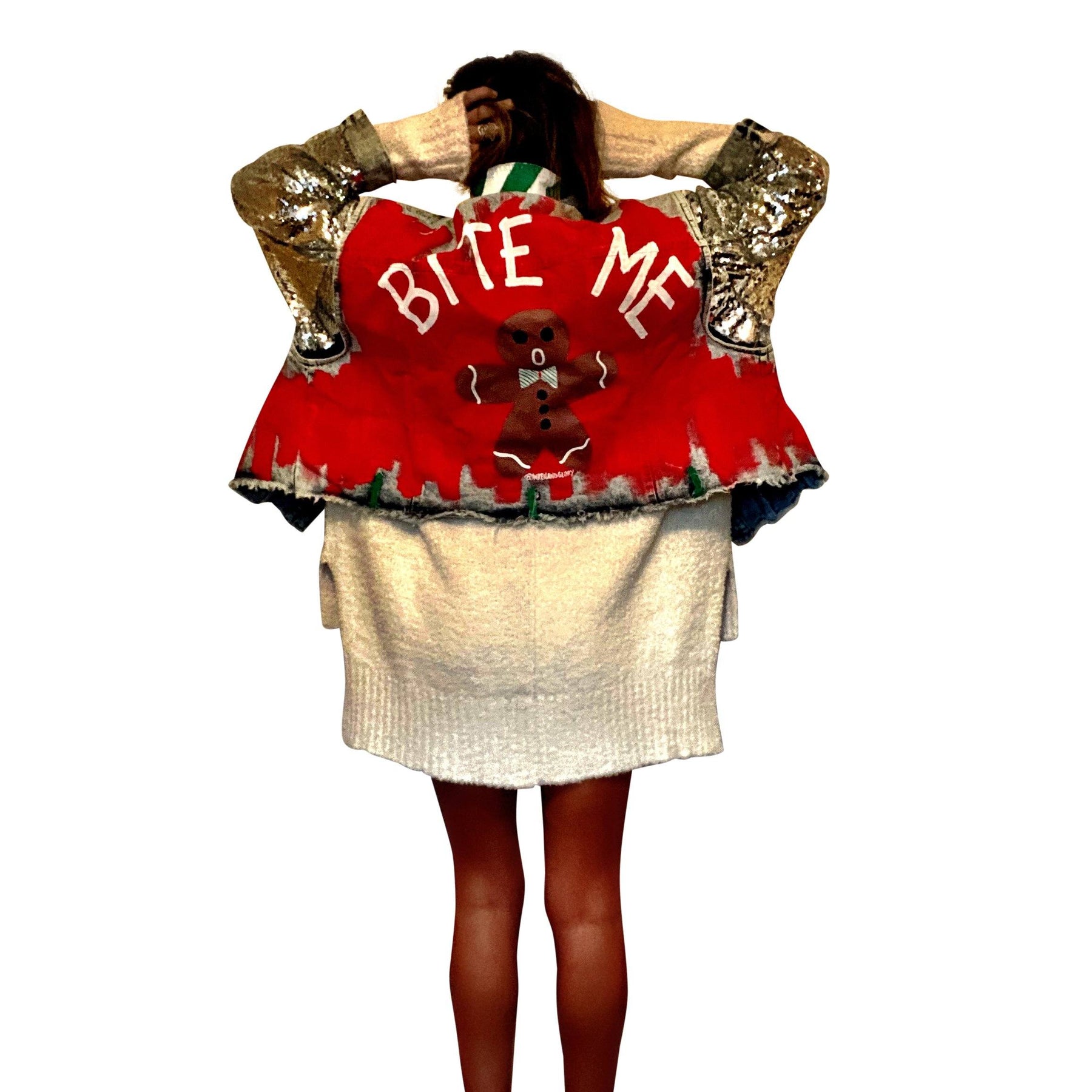 Blue denim jacket with sequined sleeves. Red base painted throughout, with gingerbread man on back, and BITE ME in semi circle above it. Signed @wrenandglory.