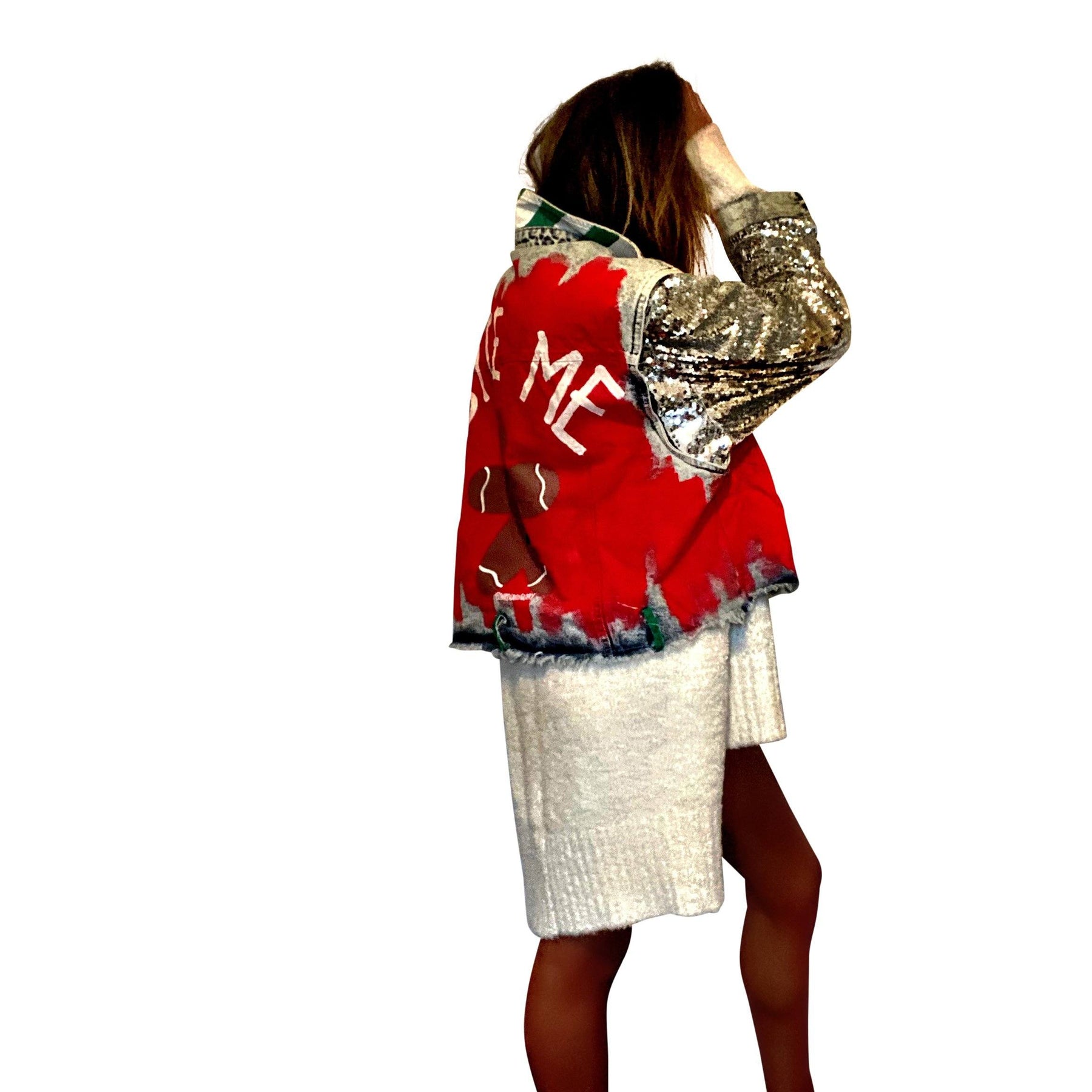 Blue denim jacket with sequined sleeves. Red base painted throughout, with gingerbread man on back, and BITE ME in semi circle above it. Signed @wrenandglory.