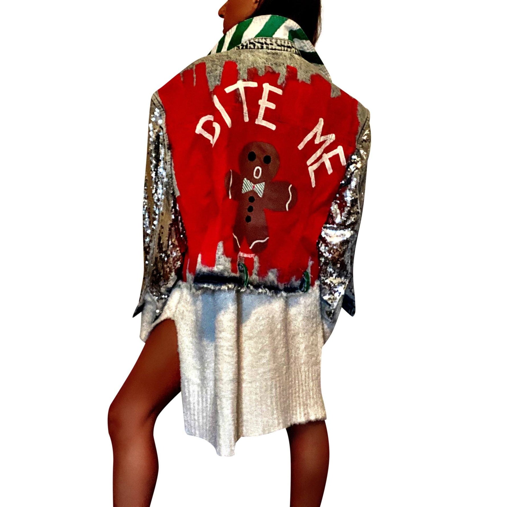 Blue denim jacket with sequined sleeves. Red base painted throughout, with gingerbread man on back, and BITE ME in semi circle above it. Signed @wrenandglory.