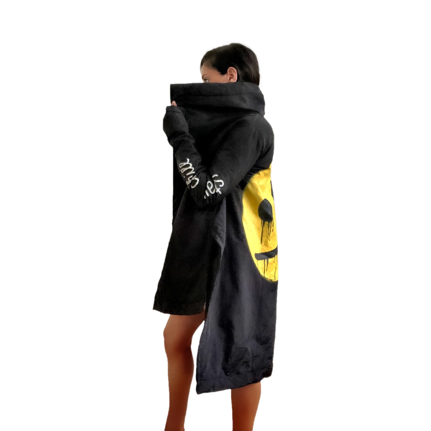 The COOLEST puffer jacket. Large smiley painted on back in yellow, with black drip eyes and mouth. STAY CHILL painted in white on sleeve. Signed @wrenandglory.