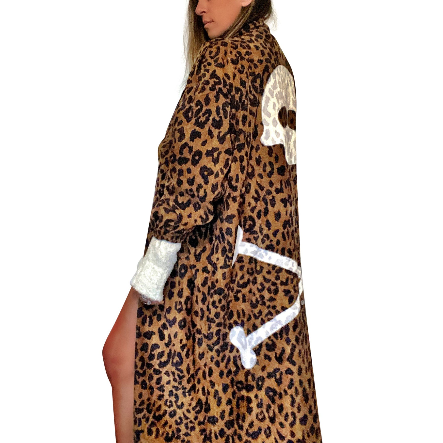 Long, lightweight velvet, leopard pattern trench coat. Skull and cross bones painted on back in white. Signed @wrenandglory.