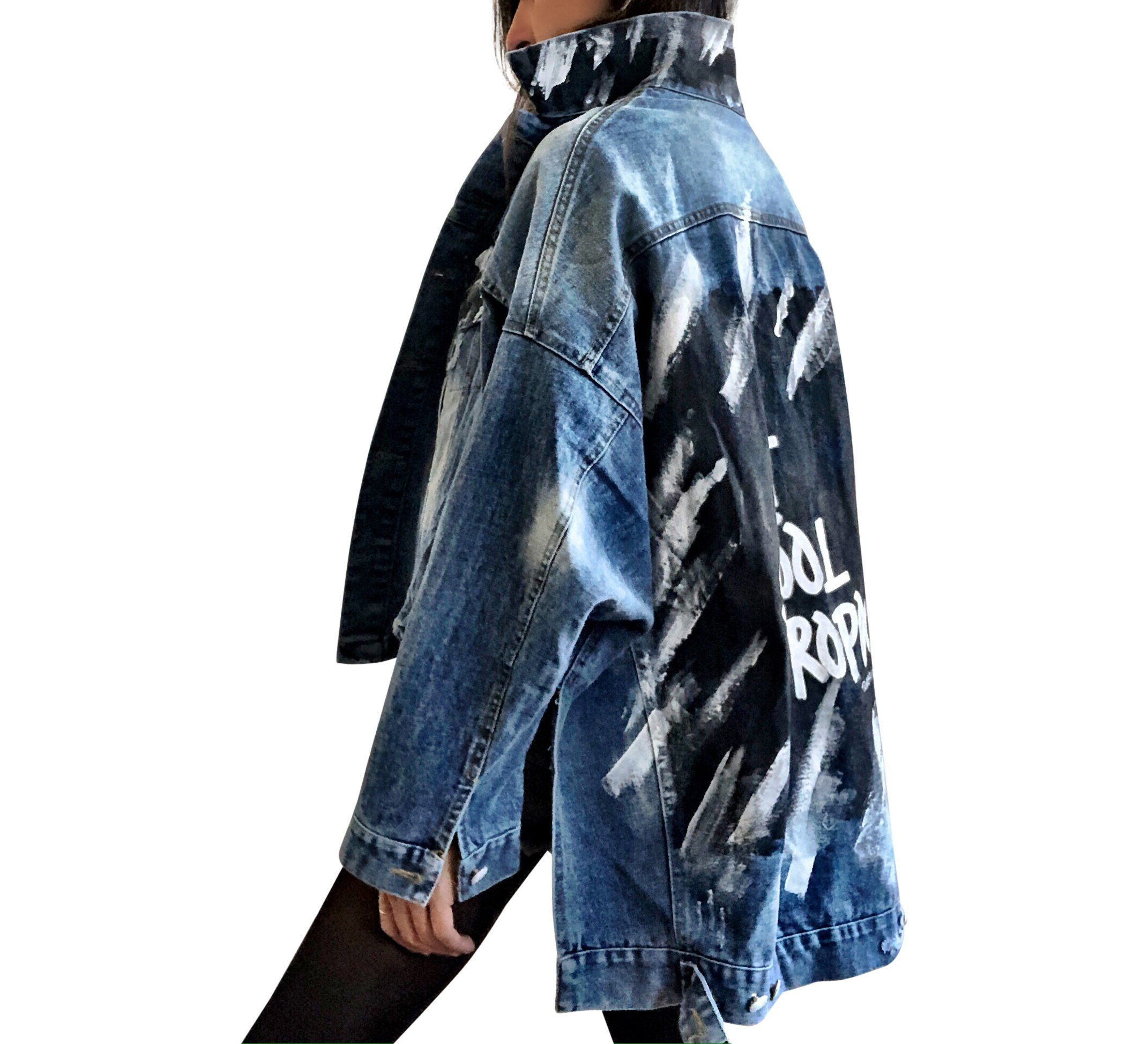 Dark blue denim jacket with long back. White and black pattern painted on back, with ART SCHOOL DROPOUT painted over it in white. Collar and front pockets painted with black and white pattern. Signed @wrenandglory.