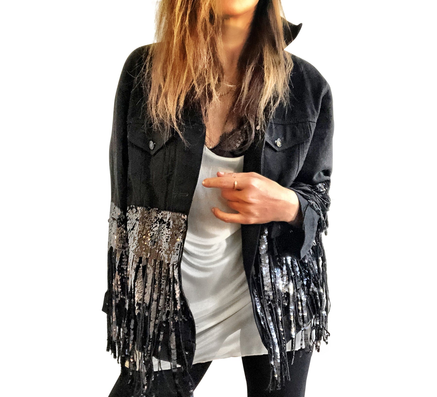 Black denim jacket with black sequin fringes hanging off on bottom half of jacket, and below elbows, Positive motivation painted in black, over white base, on back. Inspired by resolutions for 2020. Signed @wrenandglory.