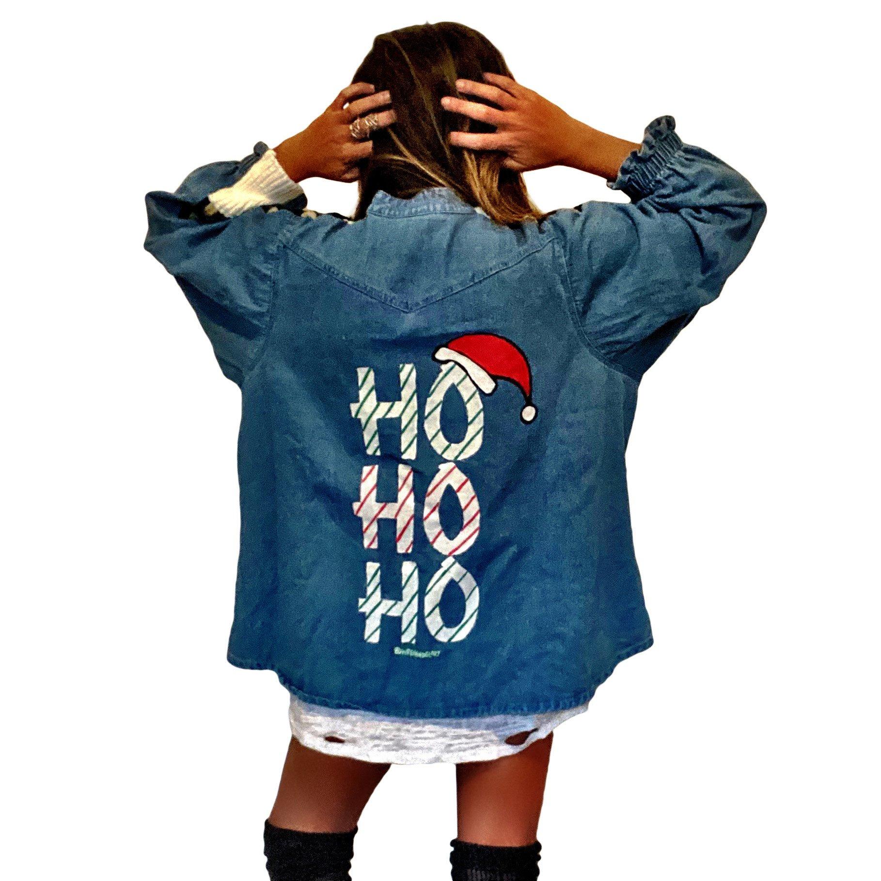 Knit sweater, with denim shirt on back. HO HO HO painted in white, green and red on back with small Santa hat. Signed @wrenandglory.