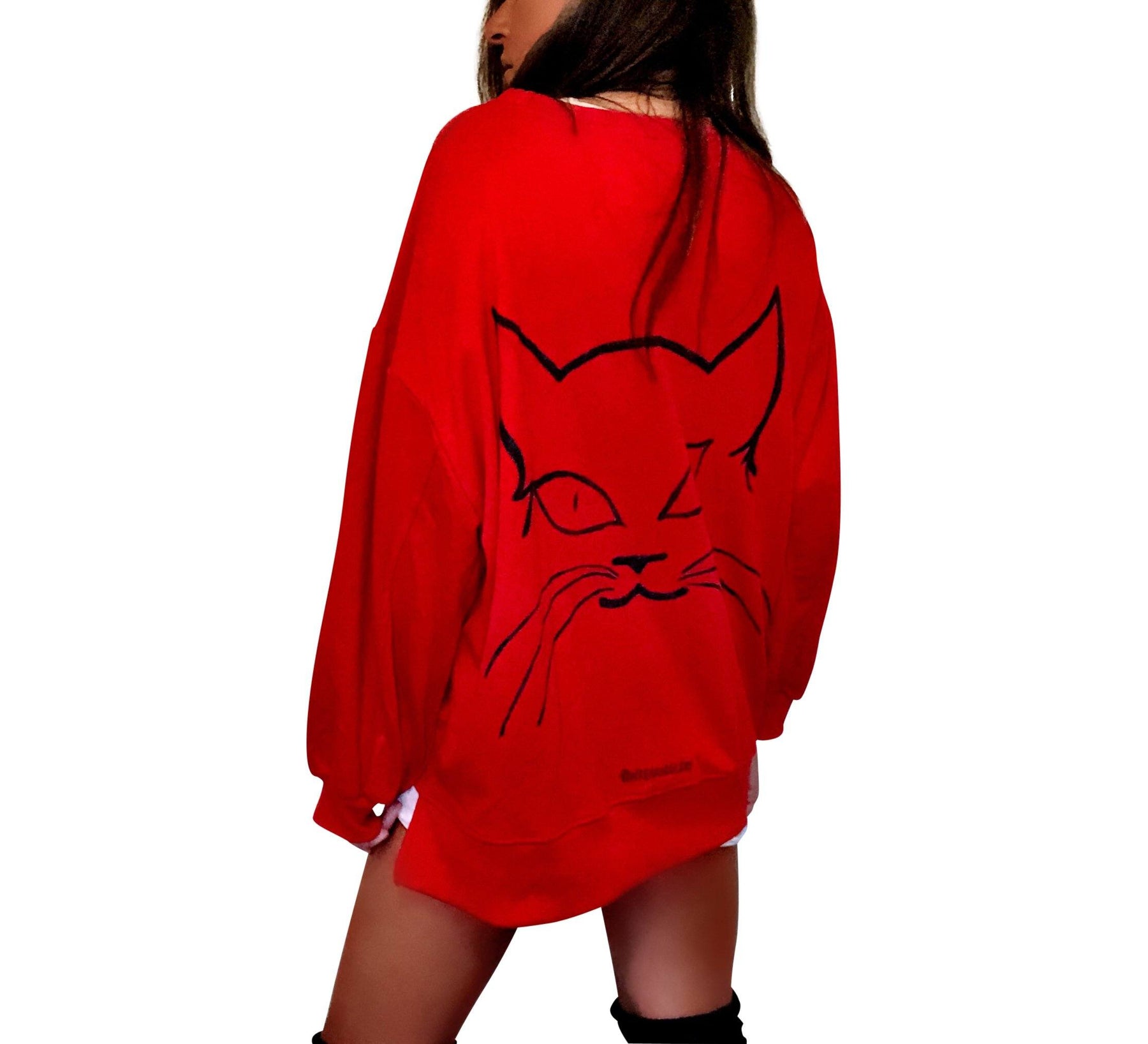 Oversized red sweatshirt. Silhouette of cat painted in black on back, with MEOW painted on front upper side. Signed @wrenandglory.