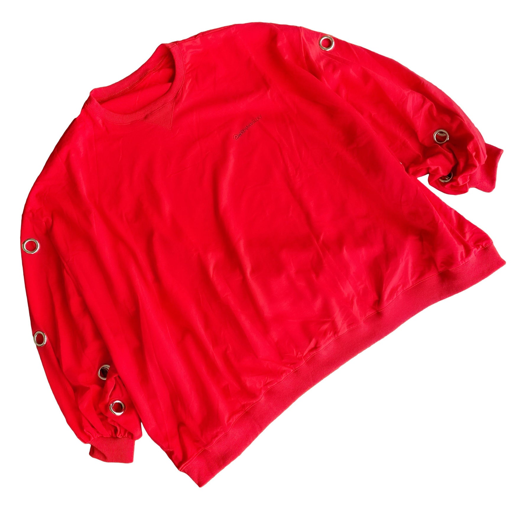 Oversized, batwing red sweatshirt with rings on sleeves. UGLY CHRISTMAS SWEATER painted on the back in black, with green paint drips coming from letters. Signed @wrenandglory