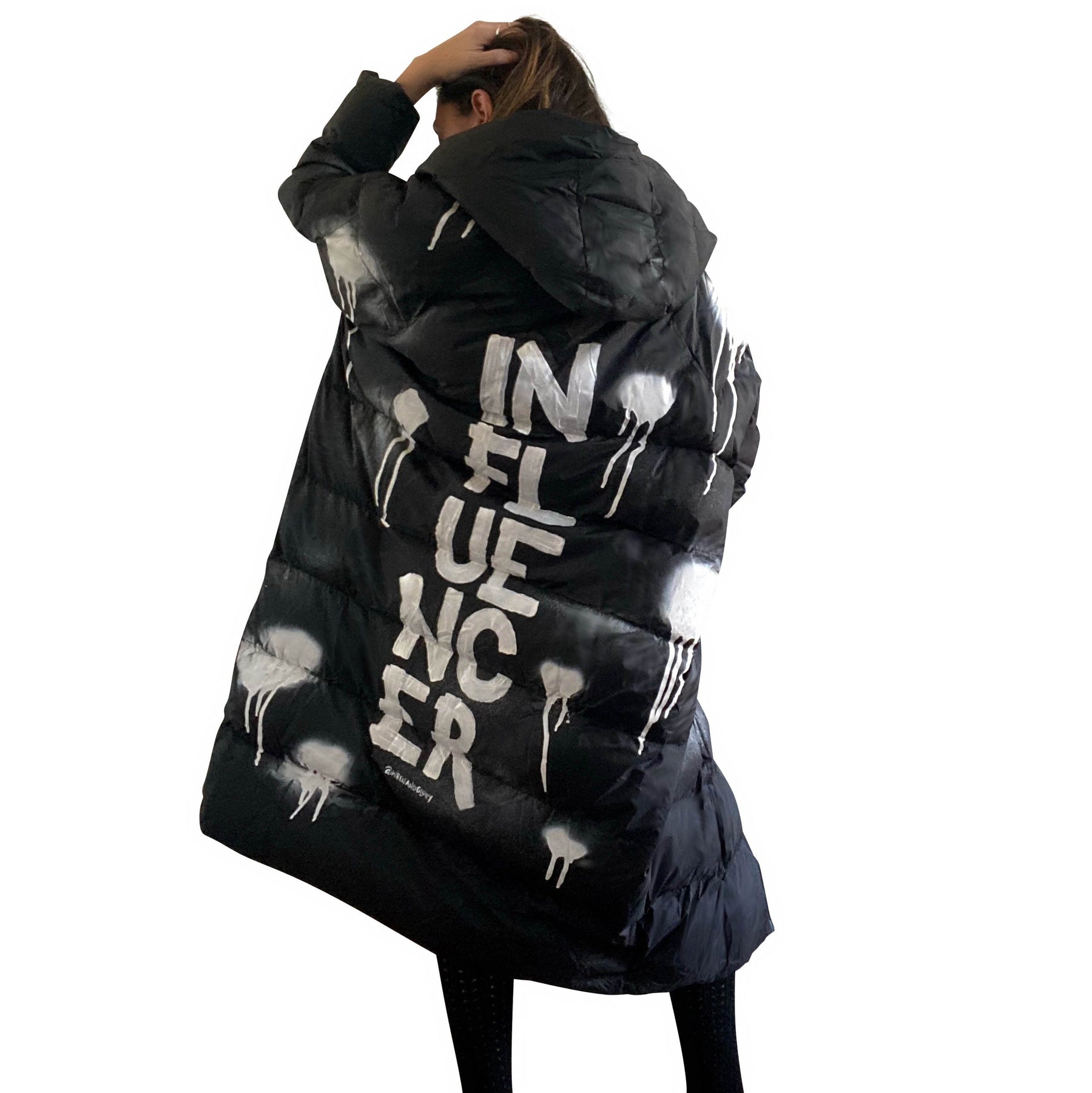 The COOLEST, MOST COMFORTABLE puffer jacket. White spray paint surrounding entire jacket, with INFLUENCER painted down the back, center, in large text. Signed @wrenandglory.