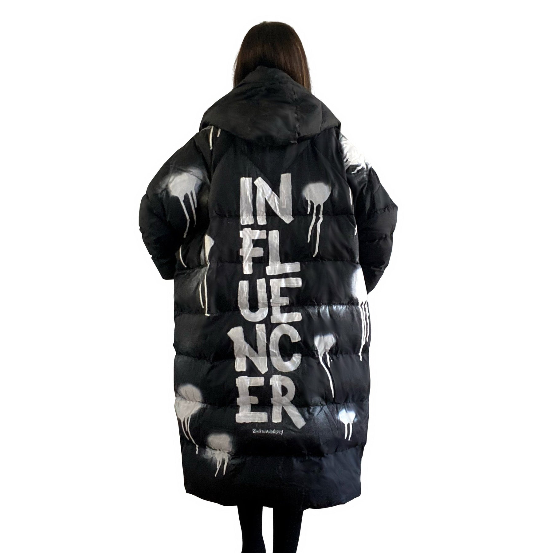 The COOLEST, MOST COMFORTABLE puffer jacket. White spray paint surrounding entire jacket, with INFLUENCER painted down the back, center, in large text. Signed @wrenandglory.