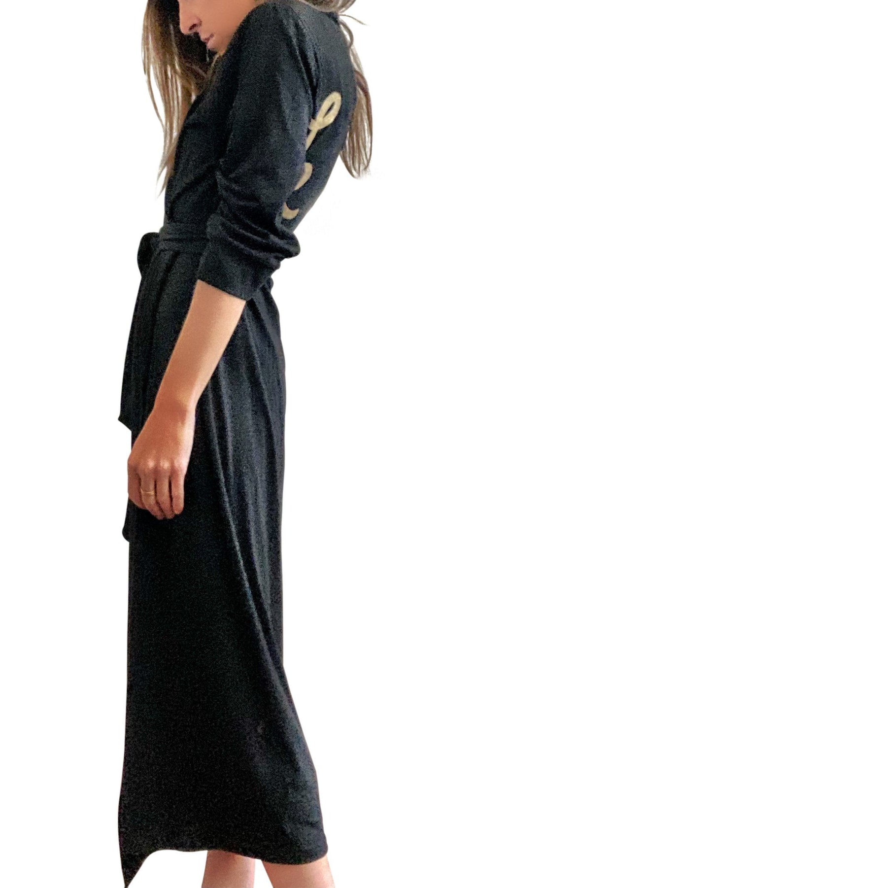 Black, super soft, stretch cotton. robe. LE TIRED painted on the back in gold. Belted, with inside ties for secure closure. Signed @wrenandglory.