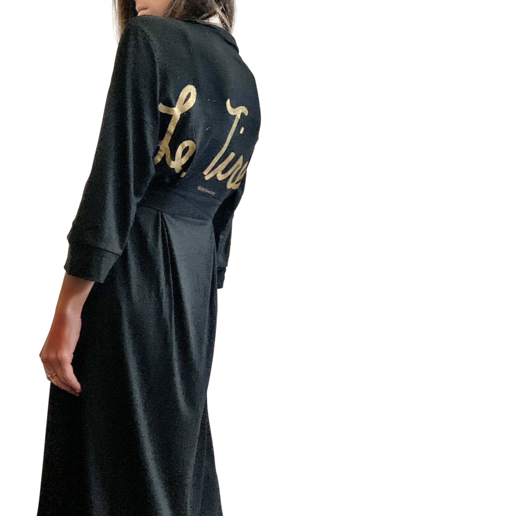Black, super soft, stretch cotton. robe. LE TIRED painted on the back in gold. Belted, with inside ties for secure closure. Signed @wrenandglory.
