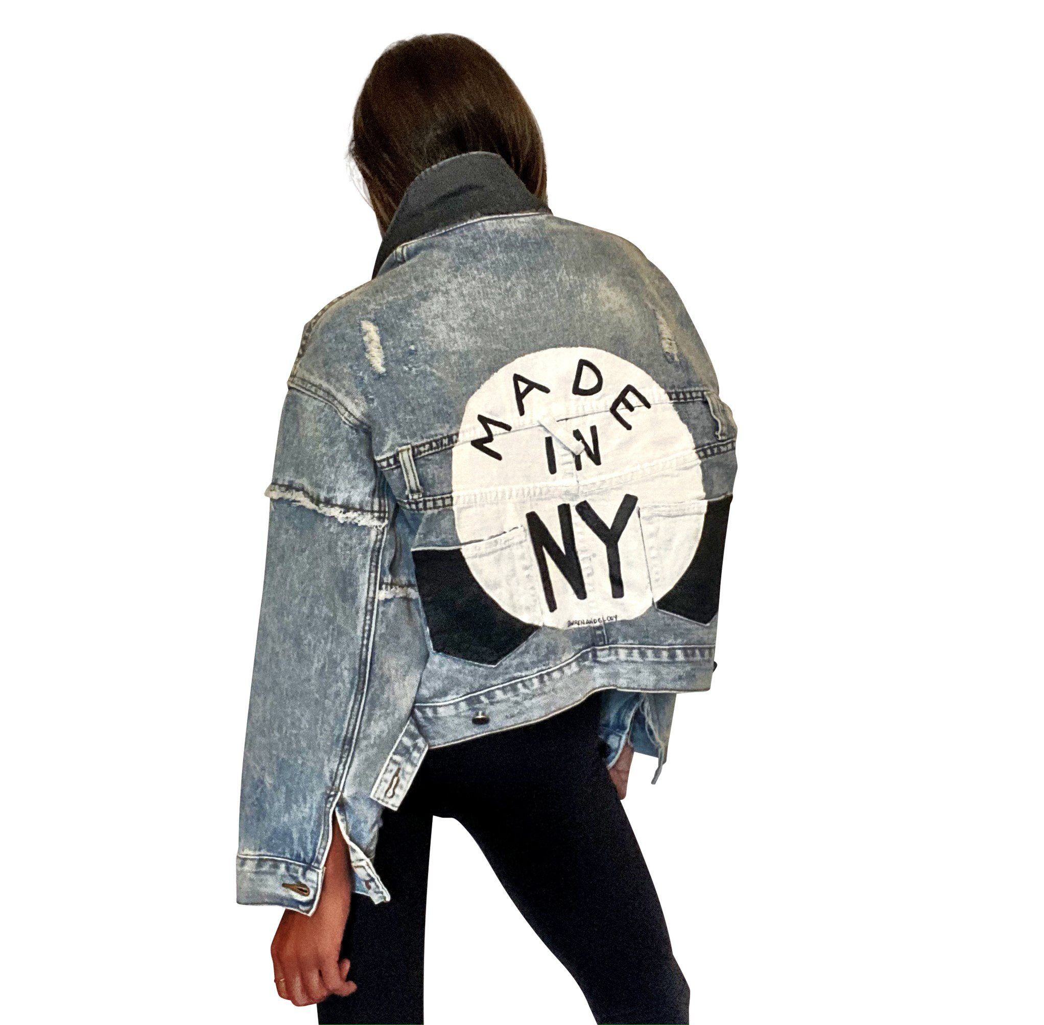 Lighter blue denim wash. White circle, painted MADE IN NYC inside in black. Pockets and hems painted black Signed @wrenandglory.