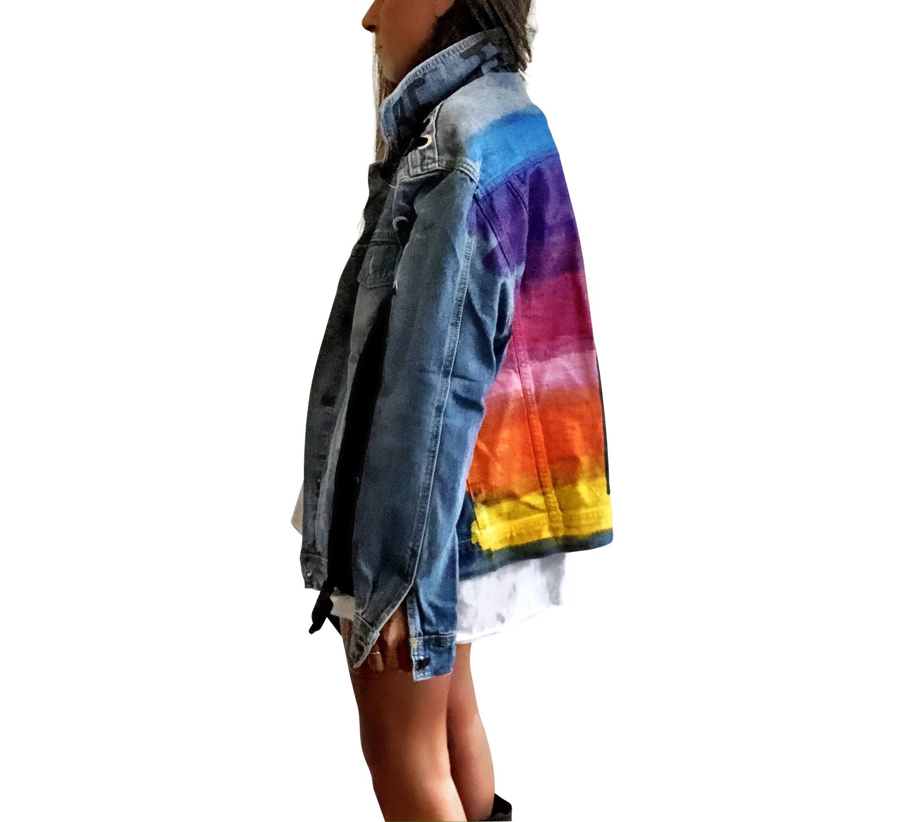 Dark blue denim wash, with velvert ribbon threaded through arms and front, lower left side. Ombre of colored striped on back, with large black initial painted in open block font over the colors. 'BE THE MAGIC' painted on color in black. Please specify initial above. Signed @wrenandglory.