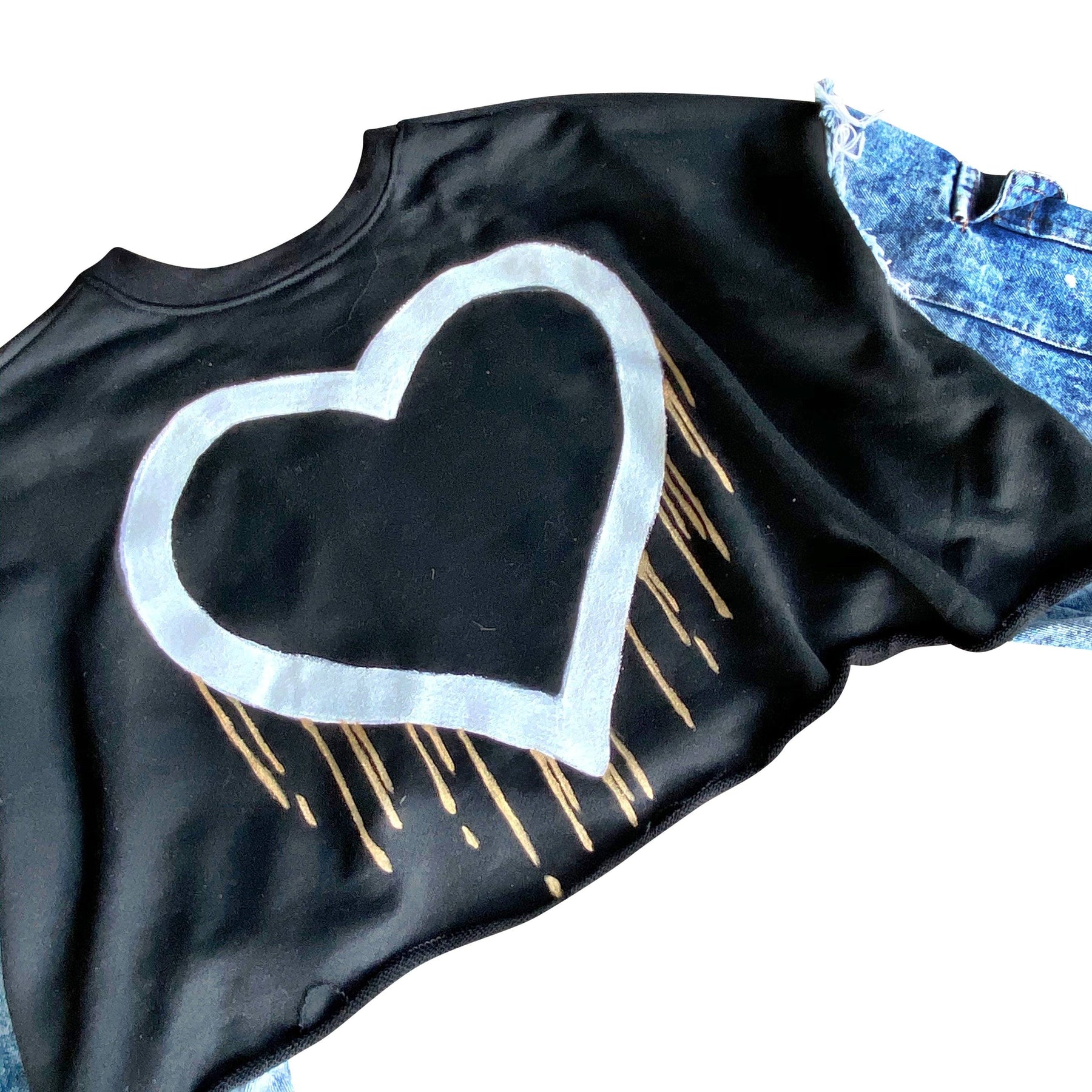 Cropped sweatshirt with denim sleeves. Large heart painted in white, with gold drip effect. Heart side can be worn on the front or on the back. Black painted on pockets of sleeves. Signed @wrenandglory.