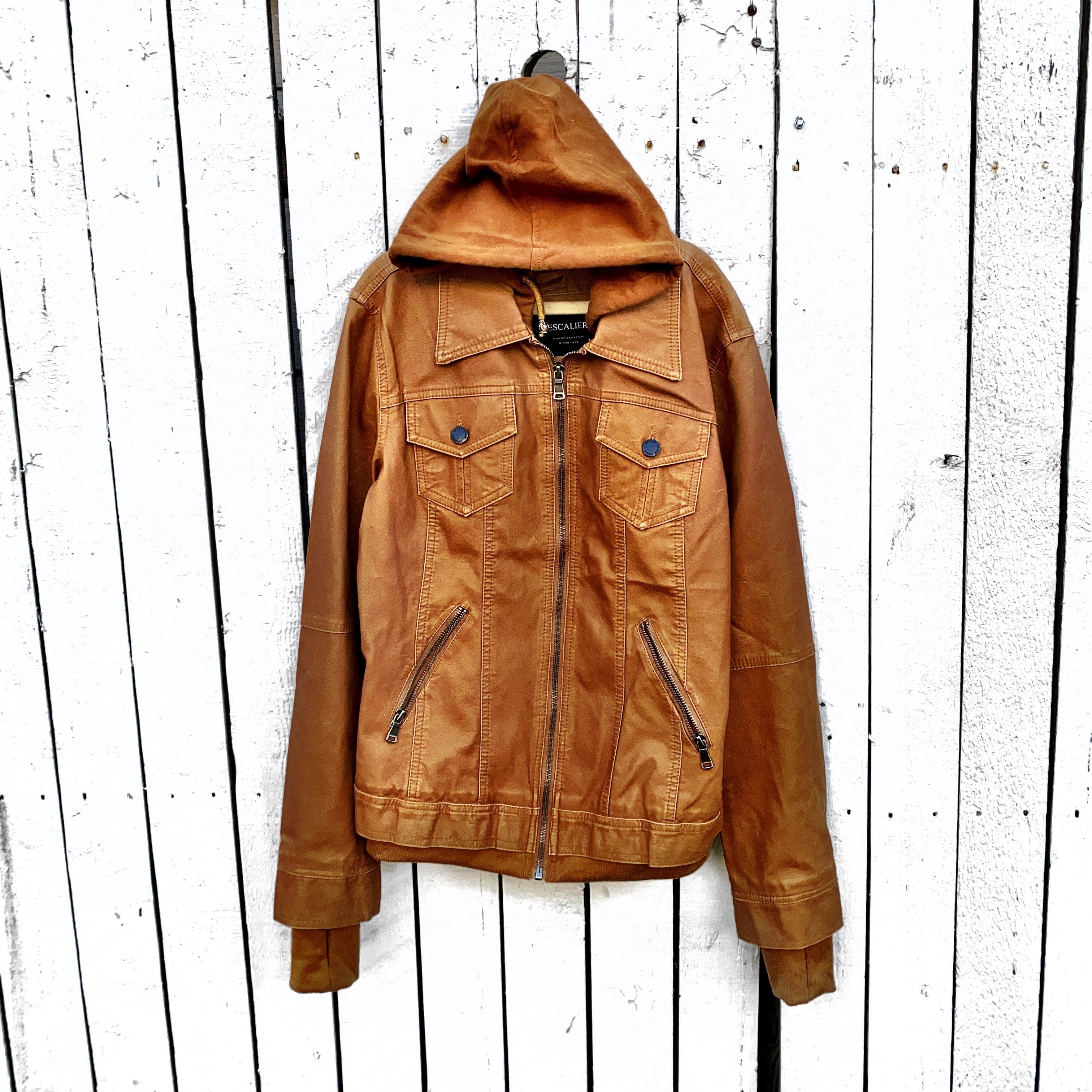 Tan, faux leather jacket with Brown hooded sweatshirt lining the inside and thumbholes at sleeves. 'F*CK DRAMA LET'S PARTY' painted along back of sleeves and upper back of jacket, in black, with white outline. Signed @wrenandglory.