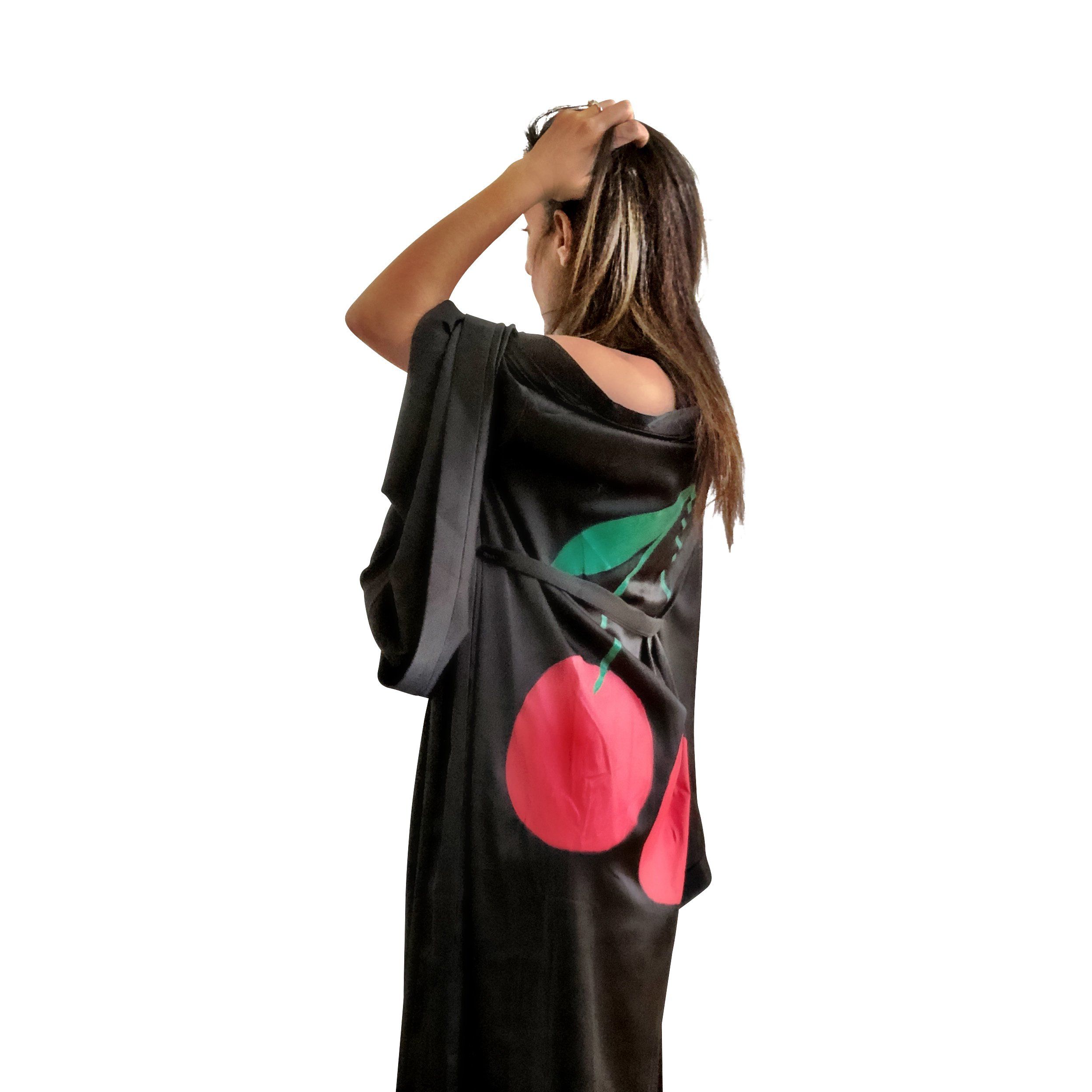 Black, super soft, satin long kimono robe. Pair of cherries painted in back in in red and green. Belted, with bell sleeves. Signed @wrenandglory.