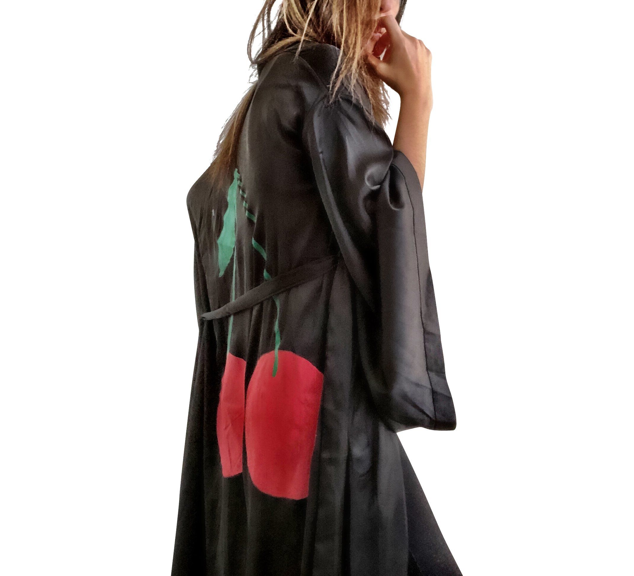 Black, super soft, satin long kimono robe. Pair of cherries painted in back in in red and green. Belted, with bell sleeves. Signed @wrenandglory.