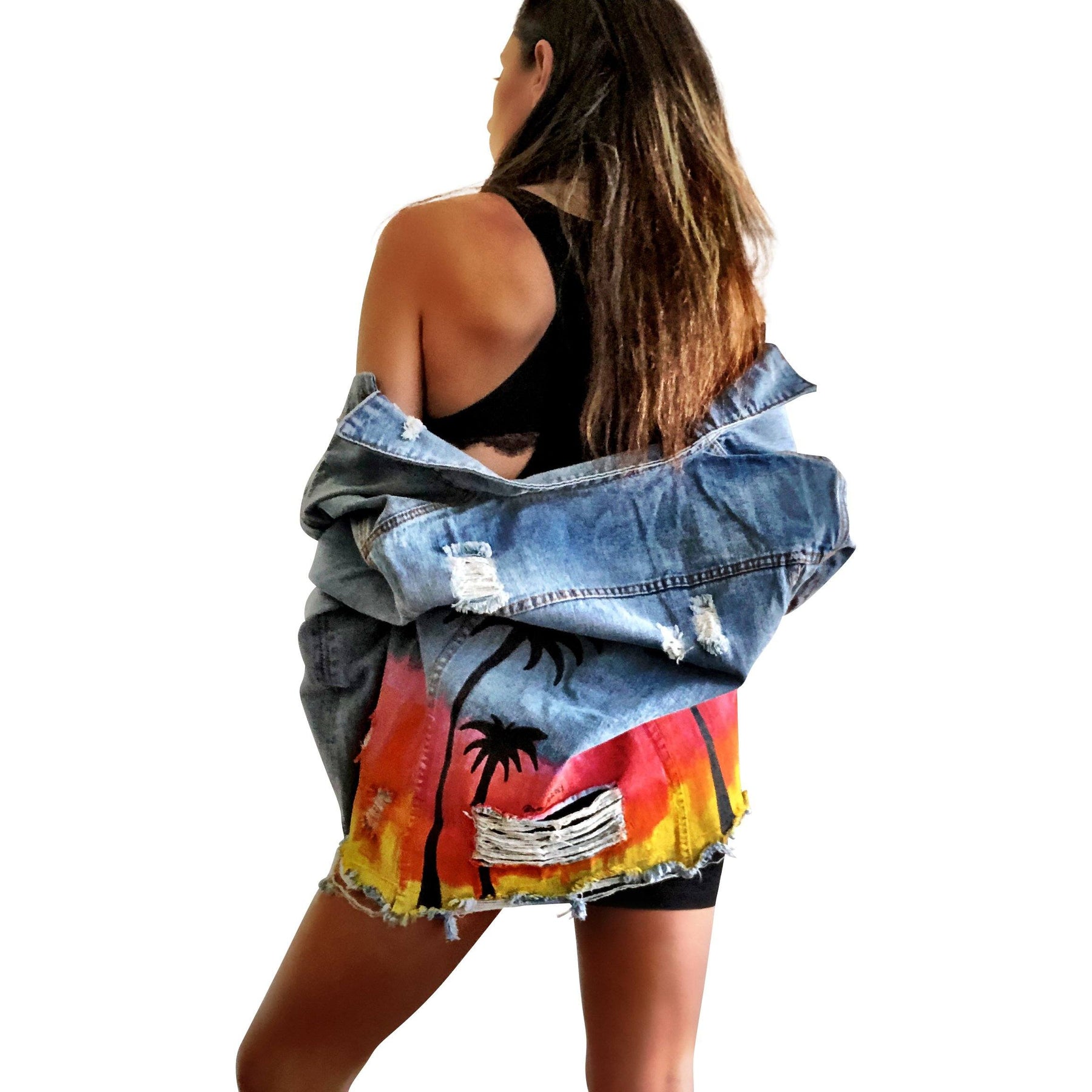 Medium blue denim wash. Heavily inspired by Coachella with ombre sunset colors painted along entire bottom half of jacket, with black silhouettes of Palm Trees surrounding. Button painted black. Signed @wrenandglory.