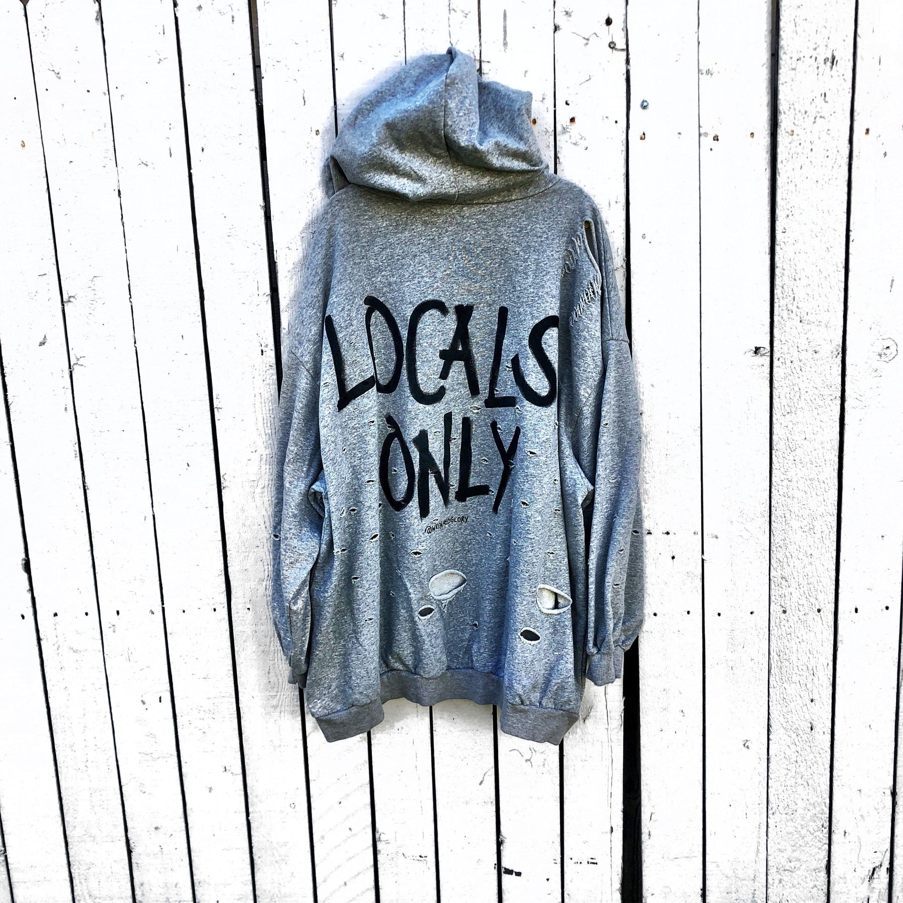 The perfect oversized, gray, distressed hoodie. LOCALS ONLY painted in back in with NYC 2019 in small along edge of hood. Signed @wrenandglory.