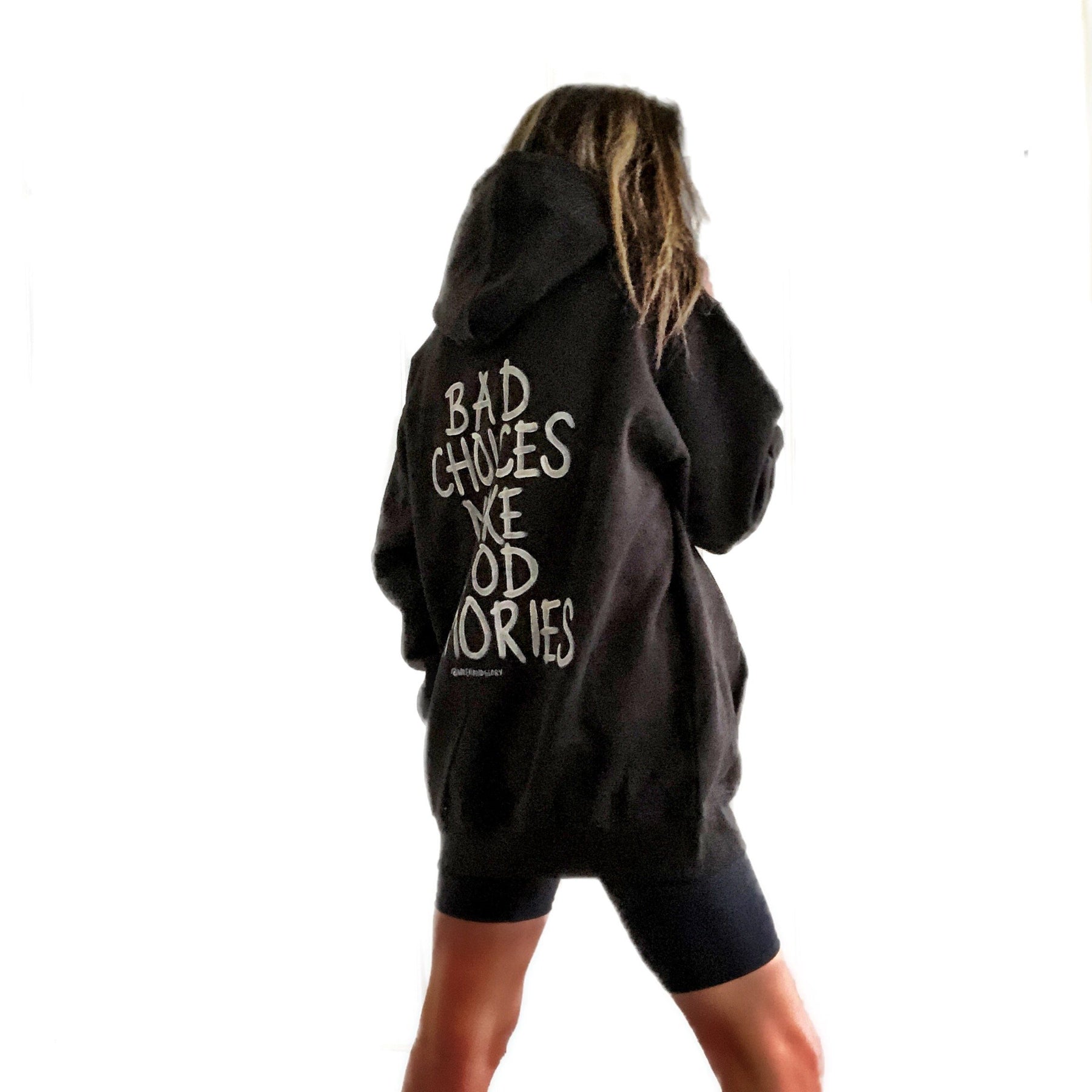 The perfect oversized, black hoodie. BAD CHOICES MAKE GOOD MEMORIES painted in back in white. Signed @wrenandglory.