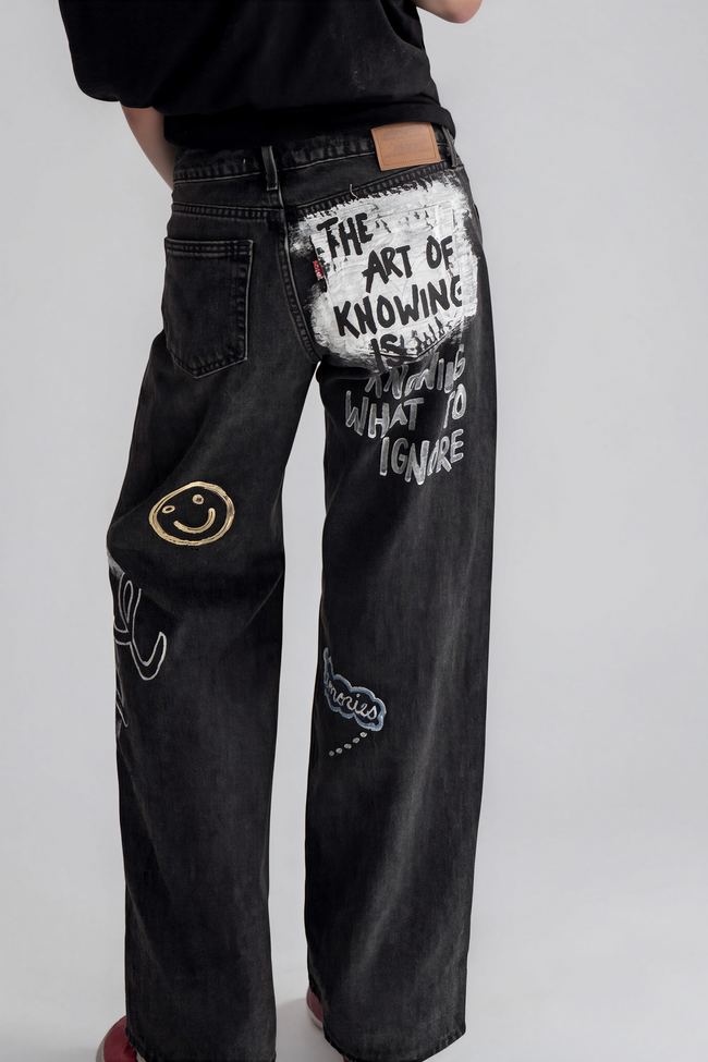 Painted jeans styled with a simple black top