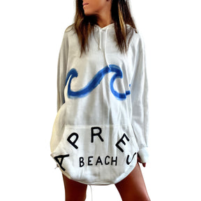 Oversized white sweatshirt dress. Blue wave painted along entire sweatshirt, on chest area, with APRES BEACH painted in black on front pocket. Signed @wrenandglory.