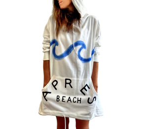 Oversized white sweatshirt dress. Blue wave painted along entire sweatshirt, on chest area, with APRES BEACH painted in black on front pocket. Signed @wrenandglory.