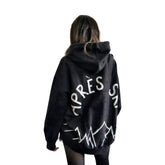 The perfect oversized black distressed hoodie. APRES SKI painted on back in semi circle, with mountain outline along bottom. Signed @wrenandglory