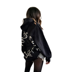 The perfect oversized black distressed hoodie. APRES SKI painted on back in semi circle, with mountain outline along bottom. Signed @wrenandglory