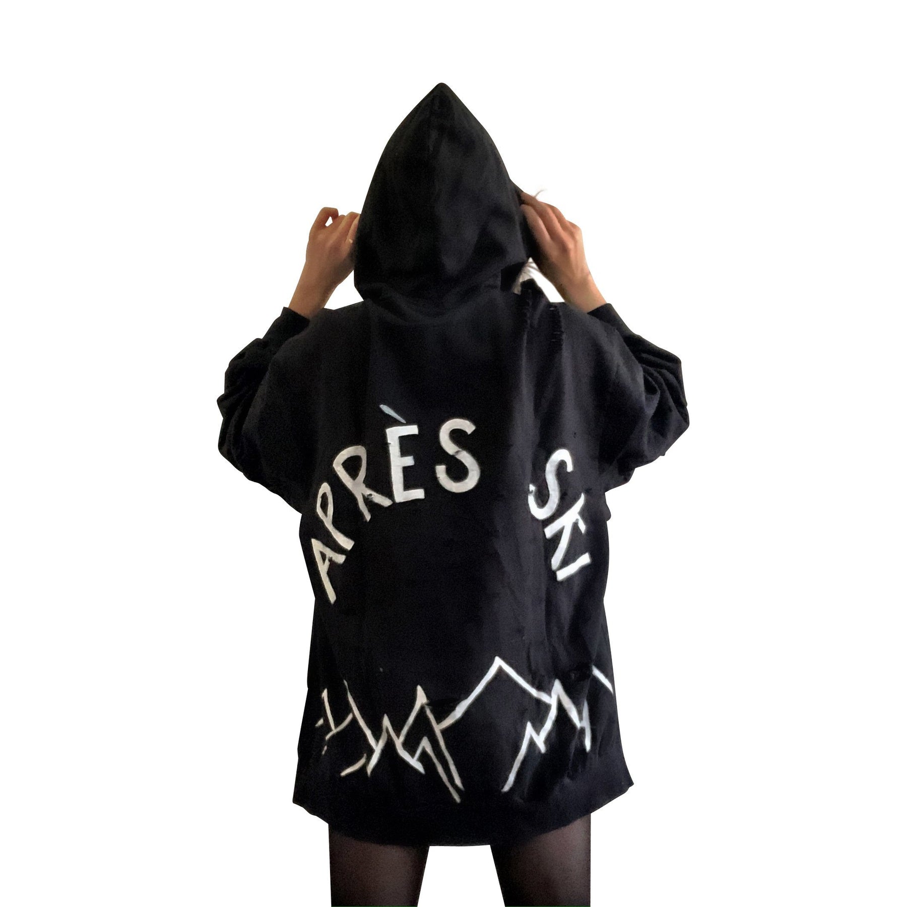 The perfect oversized black distressed hoodie. APRES SKI painted on back in semi circle, with mountain outline along bottom. Signed @wrenandglory