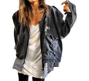 Light black denim, with black and white checkered flannel insert. 'I HAVE ONLY TWO EMOTIONS, CAREFUL FEAR AND DEAD DEVOTION' painted in white on back. ''I CANT GET THE BALANCE RIGHT' painted in white, in small, on front. Signed @wrenandglory.