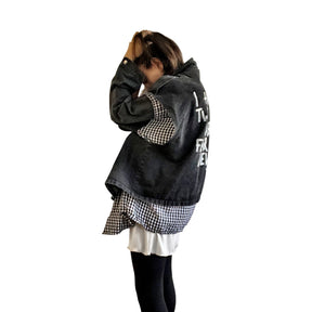 Light black denim, with black and white checkered flannel insert. 'I HAVE ONLY TWO EMOTIONS, CAREFUL FEAR AND DEAD DEVOTION' painted in white on back. ''I CANT GET THE BALANCE RIGHT' painted in white, in small, on front. Signed @wrenandglory.