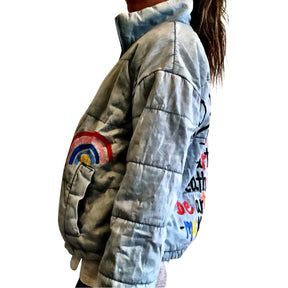 Perfect denim puffer jacket. Painted on back in black and assorted colors - TO DO: Love Art, Feel Art, Breathe Art, Be Art, Make Art Small rainbow painted on front. Signed @wrenandglory.
