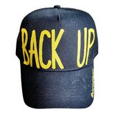 Black lack trucker hat with BACK UP painted on hat in yellow. Signed @wrenandglory