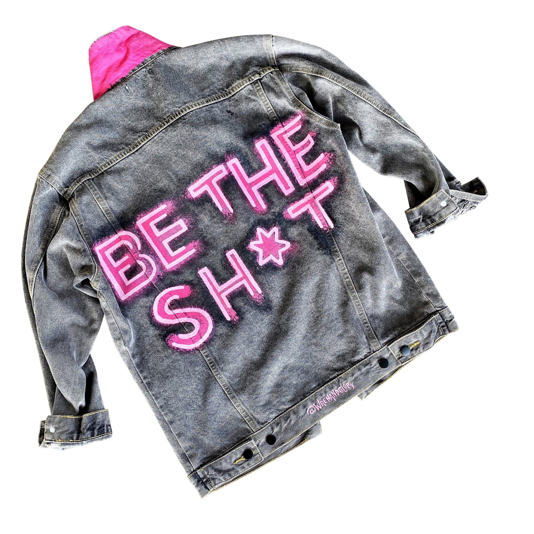Faded black denim. BE THE SH*T logo painted on back in neon effect in bright pink. Collar and front pockets painted white. Signed @wrenandglory.