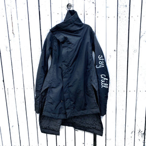 The COOLEST puffer jacket. Large smiley painted on back in yellow, with black drip eyes and mouth. STAY CHILL painted in white on sleeve. Signed @wrenandglory.