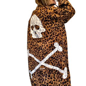 Long, lightweight velvet, leopard pattern trench coat. Skull and cross bones painted on back in white. Signed @wrenandglory.
