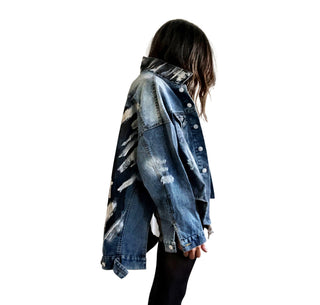 Dark blue denim jacket with long back. White and black pattern painted on back, with ART SCHOOL DROPOUT painted over it in white. Collar and front pockets painted with black and white pattern. Signed @wrenandglory.