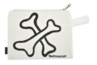 White denim zippered pouch Hand painted 'Bad Bitch' on one side, crossbones on the other.