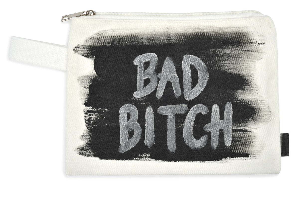 White denim zippered pouch Hand painted 'Bad Bitch' on one side, crossbones on the other.