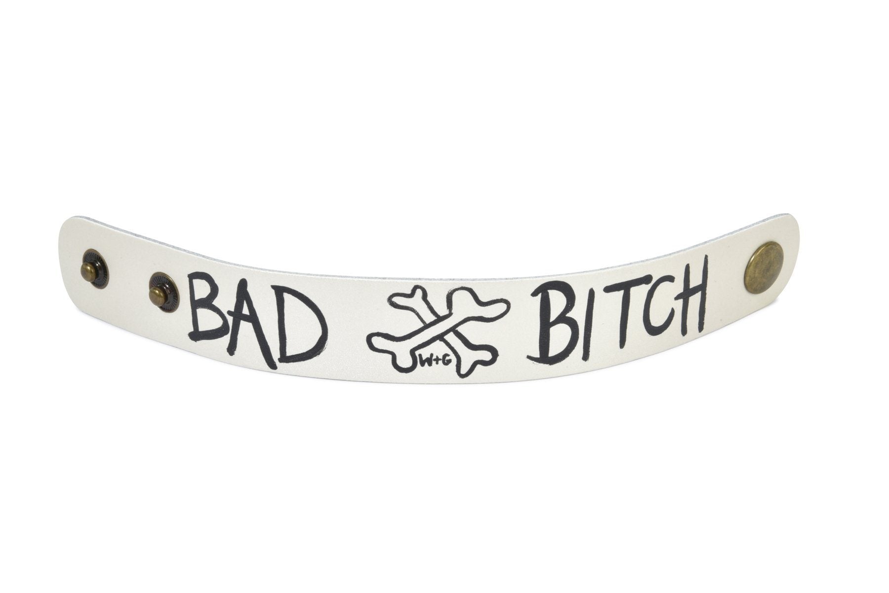 Hand made leather bracelet, hand painted with Bad B*tch and crossbones.  White leather, black paint. Signed W+G