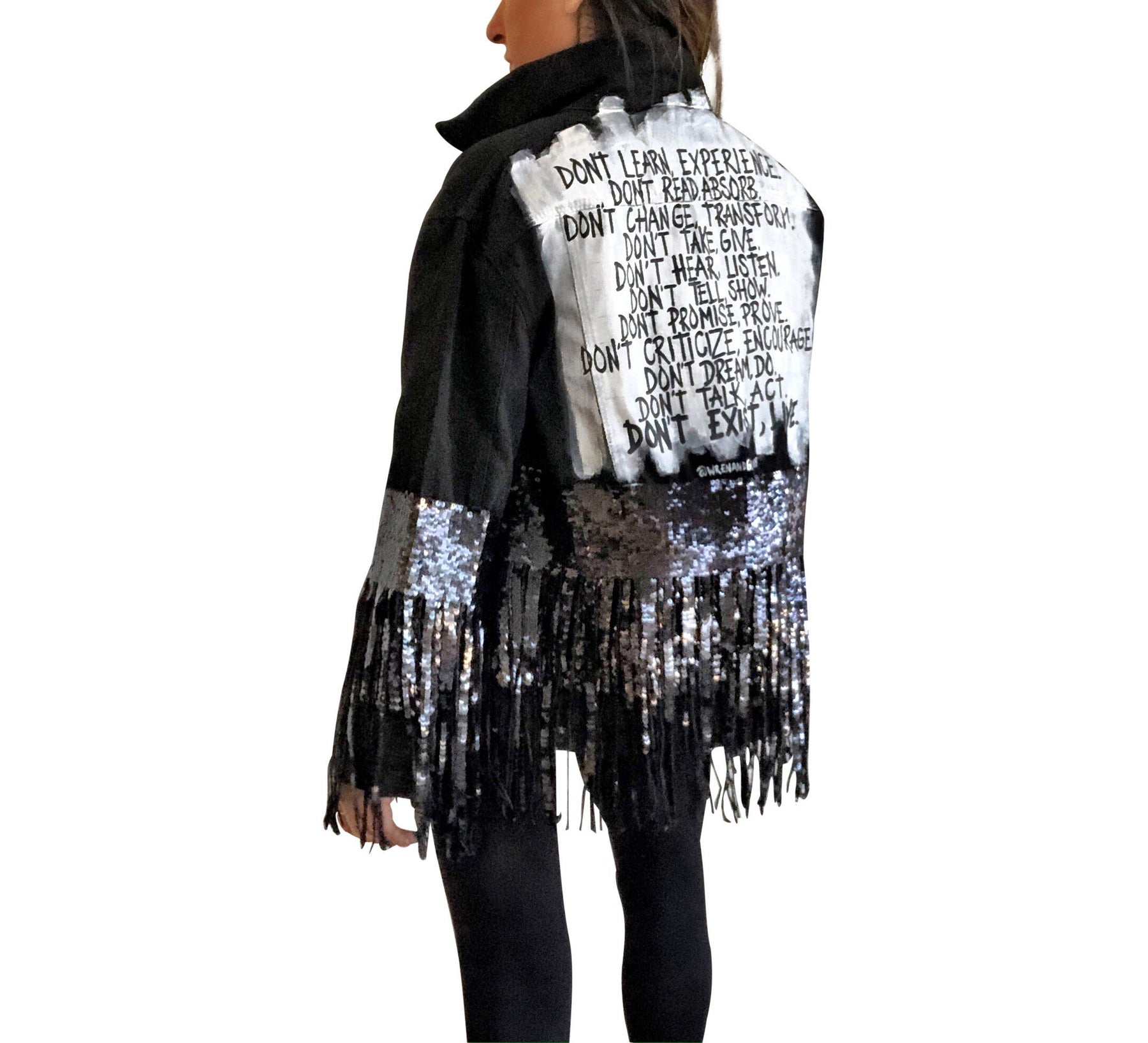 Black denim jacket with black sequin fringes hanging off on bottom half of jacket, and below elbows, Positive motivation painted in black, over white base, on back. Inspired by resolutions for 2020. Signed @wrenandglory.