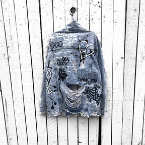 Light blue denim wash. Graffiti style paint throughout entire jacket, in black and white. Choose your name and city to be painted on. Please specify info above. Signed @wrenandglory.