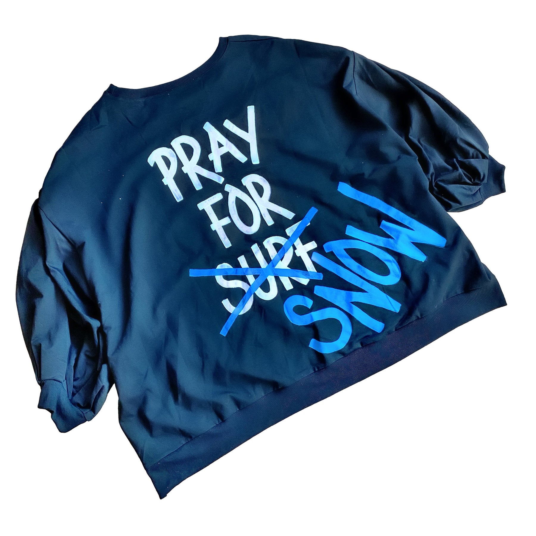 The perfect oversized sweatshirt & jogger loungewear set. TOP: PRAY FOR SURF (crossed out) SNOW painted on the back in white and blue. Small snowflake painted on front, left chest. BOTTOM: Assorted sized and shaped snowflakes painted down leg. Signed @wrenandglory on both top and bottom.
