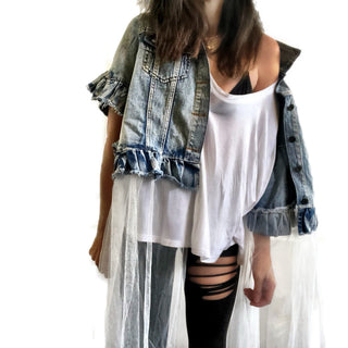 Medium blue denim short sleeve jacket with layer of long white tulle. 'But Is It Art?' painted in black on the back, with black stripes on front pockets and collar. Signed @wrenandglory.