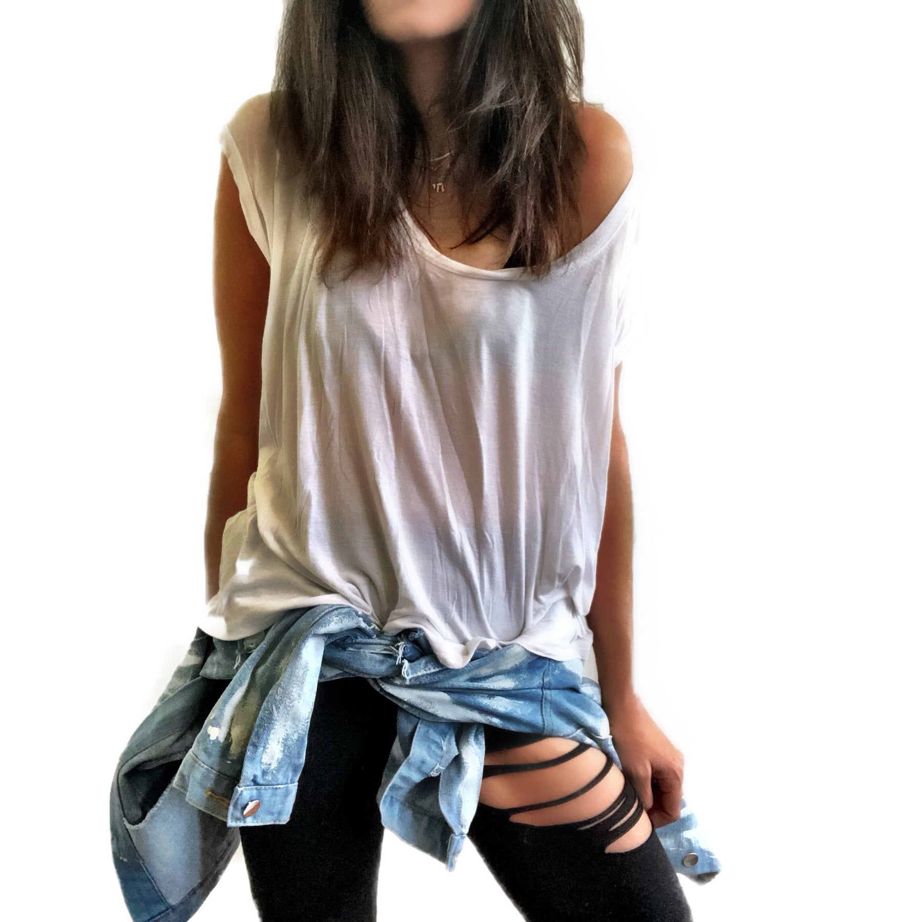 Medium blue denim wash. 'White base all over, with black and gold Hamsa painted on the back. Signed @wrenandglory.