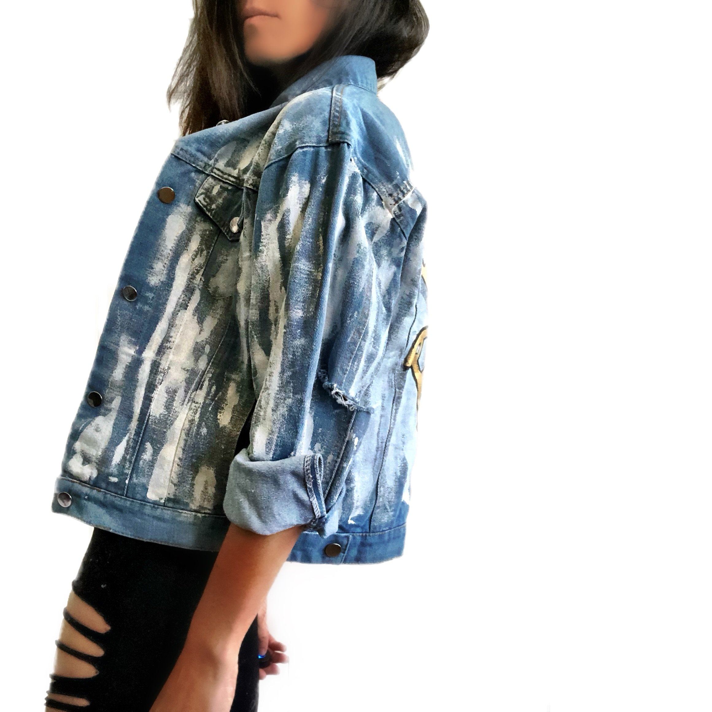 Medium blue denim wash. 'White base all over, with black and gold Hamsa painted on the back. Signed @wrenandglory.