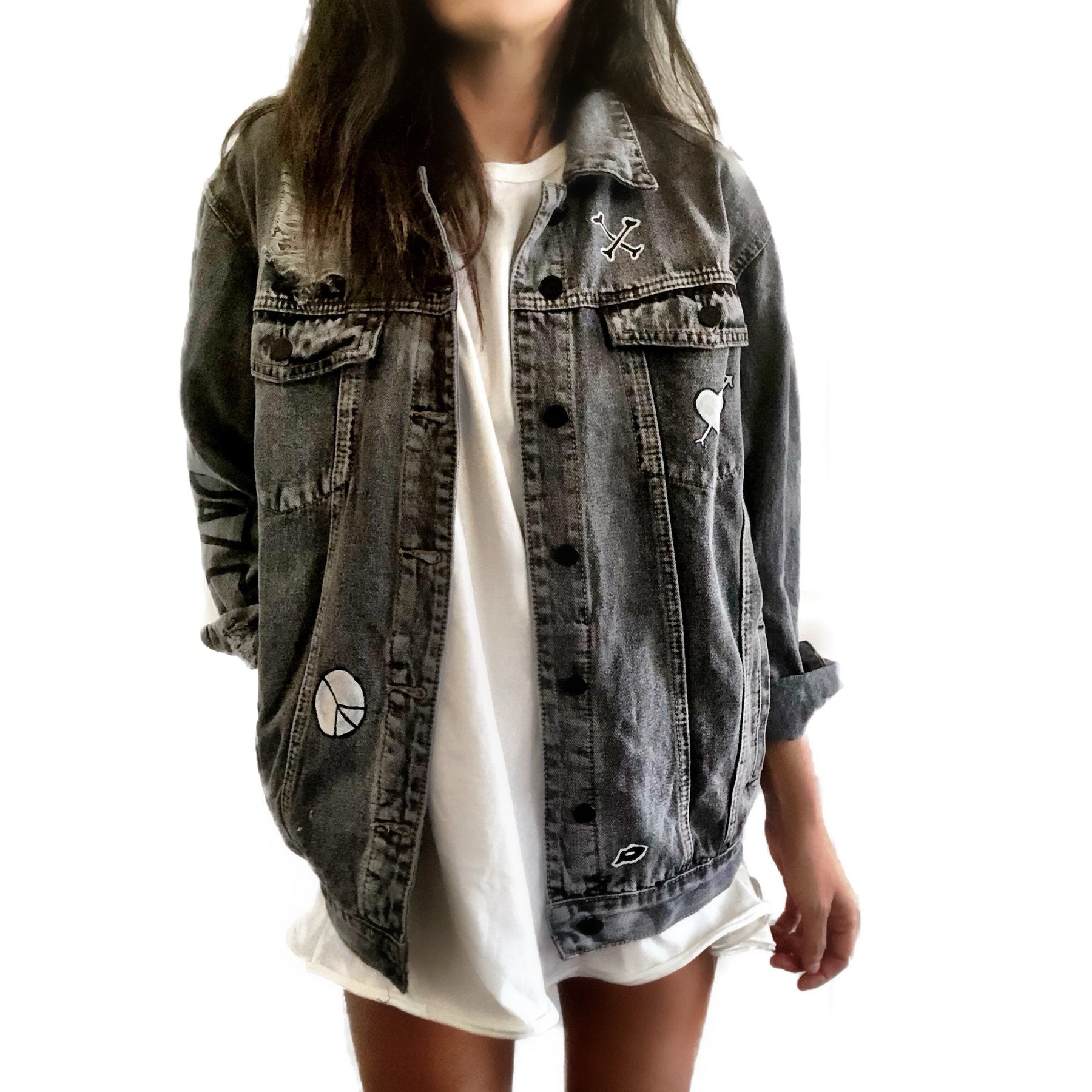Yellow smiley on faded black denim jacket, with hand painted symbols throughout. Hand painted with white, yellow and black. 'HAPPY DAZE' written down left arm. Signed @wrenandglory