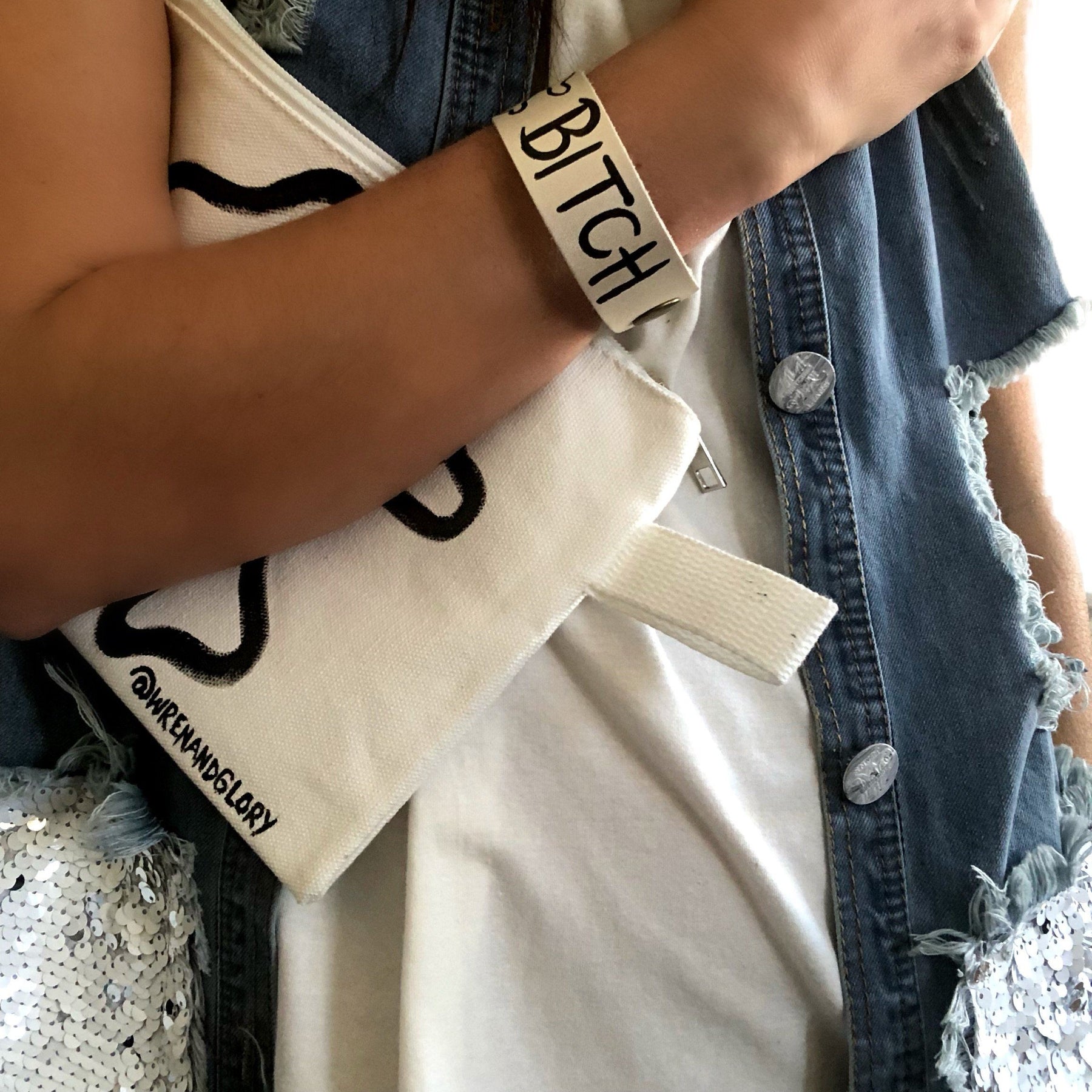 Hand made leather bracelet, hand painted with Bad B*tch and crossbones.  White leather, black paint. Signed W+G